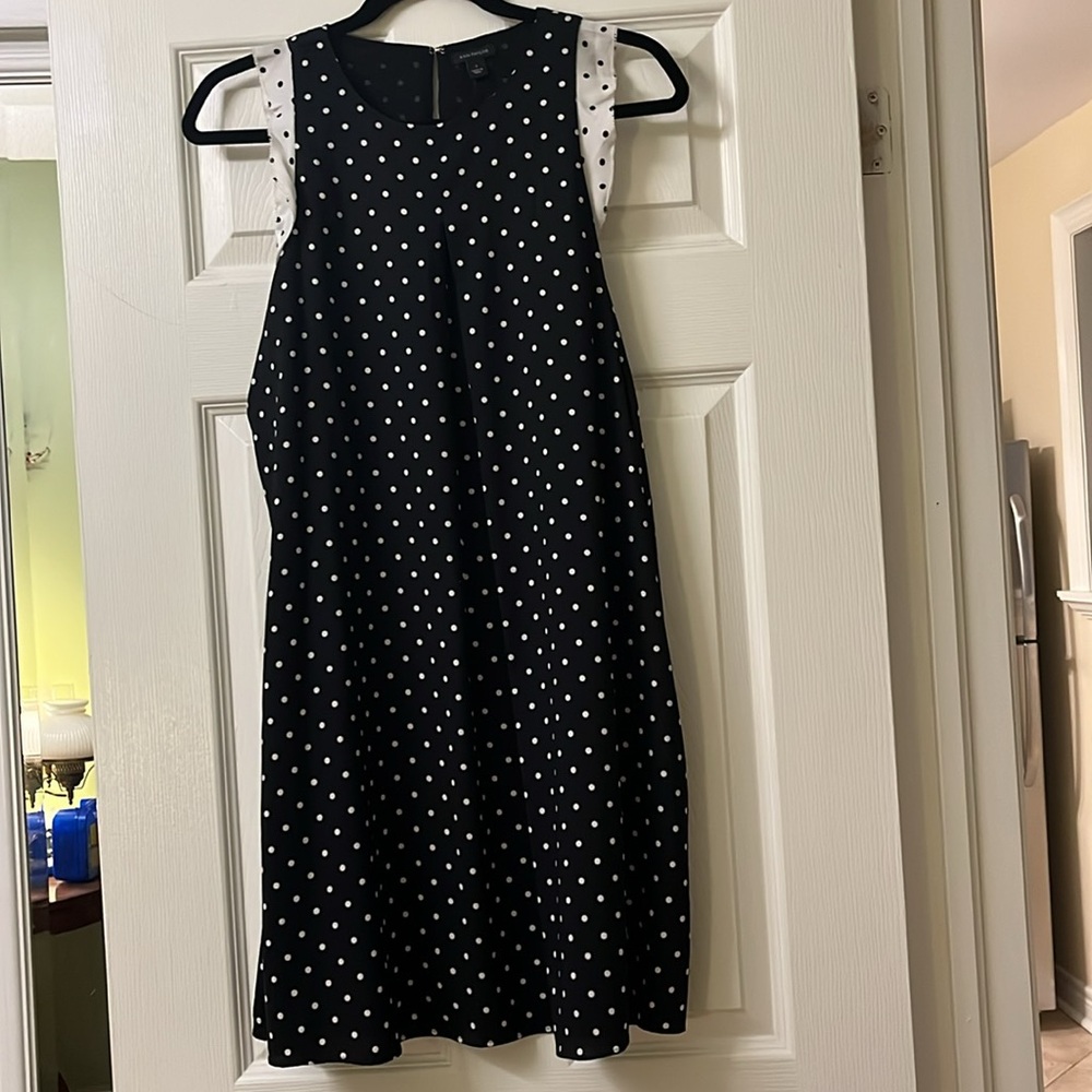 Navy and white polkadot dress.